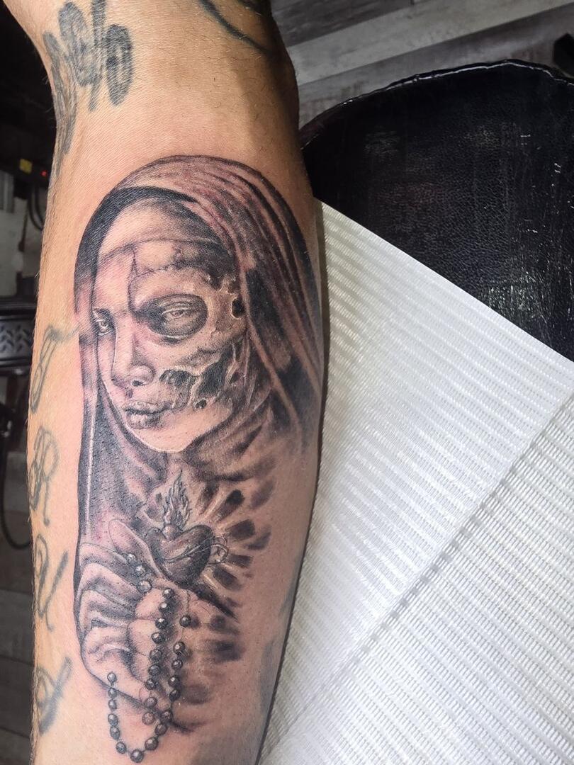 Black-and-grey Santa Muerte forearm tattoo