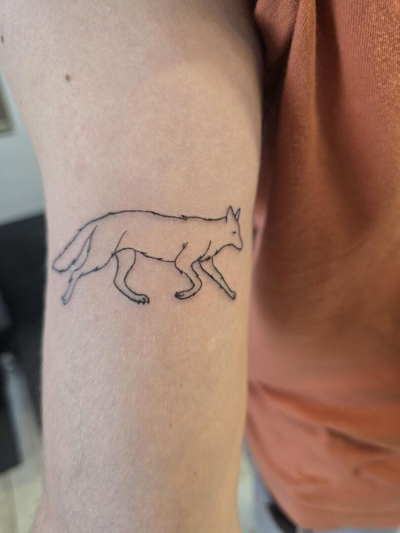 Fine-line panther tattoo