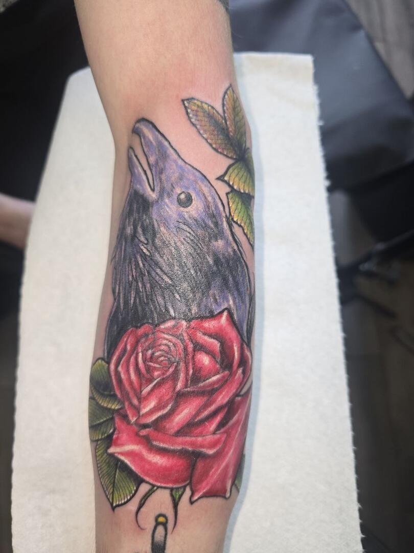 Colour rose tattoo on a forearm